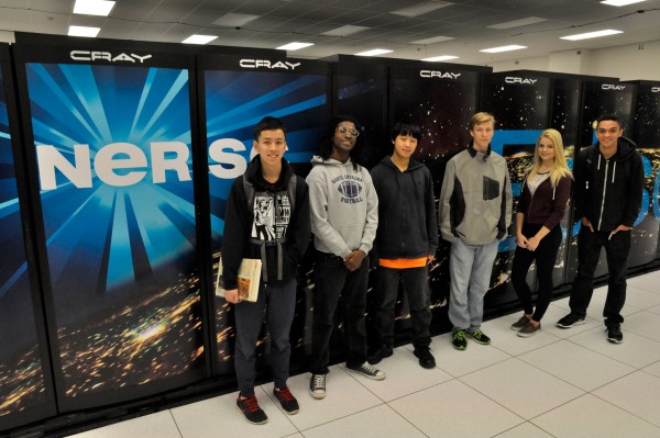 Oakland Tech students pose in front of NERSC's flagship supercomputer nick named