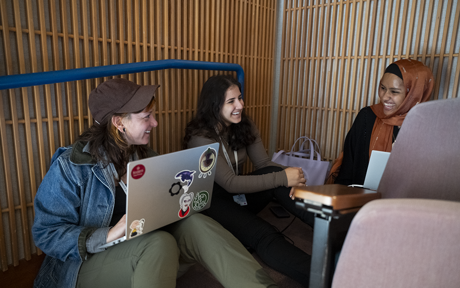 Three people laughing